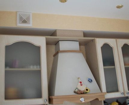 Stylishly designed hood with air duct in the kitchen Stylish hood model