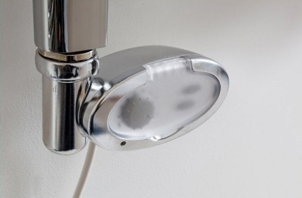 Electric heated towel rails with a temperature regulator for installation in a bathroom Thermostat functions