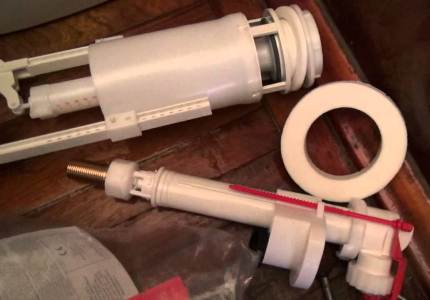 Armature for a drain tank