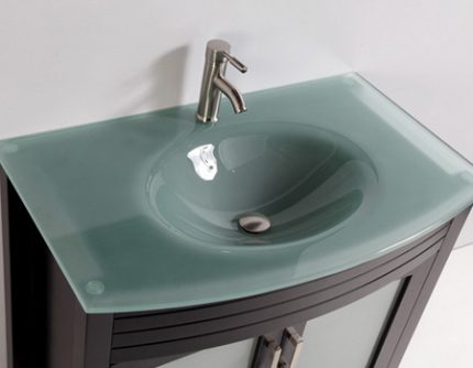 Sink holes for faucet installation The mixer is installed in glass