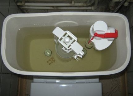How to set up a drain valve for a toilet bowl Setting the drainage mechanism