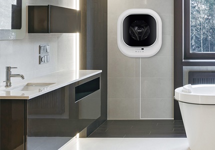 Le modèle articulé d'une machine à laver dans une petite salle de bain Modèle mural dans une salle de bain exiguë