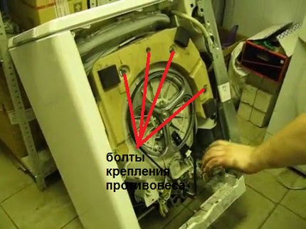 The counterweight bolts still need to be unscrewed. Counterweight Removal