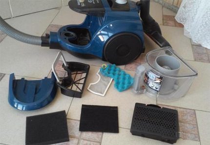 Disassembled Vacuum Filters A complete set of vacuum cleaner filters