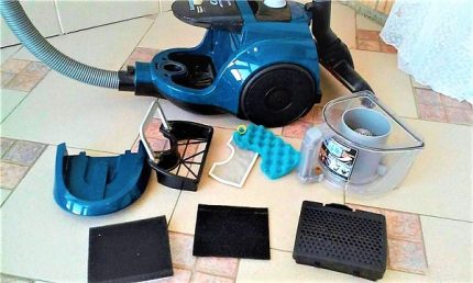 Vacuum cleaner disassembled after cleaning. Disassembled vacuum cleaner