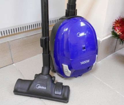 Classic vacuum cleaner with universal brush floor / carpet Midea vacuum cleaner on smooth floor