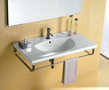 Low basin mixer Wall-mounted washbasin with low mixer tap