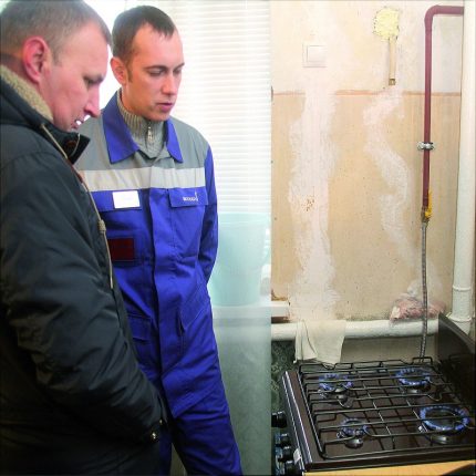 Gas Officer Visit Gasman at the stove